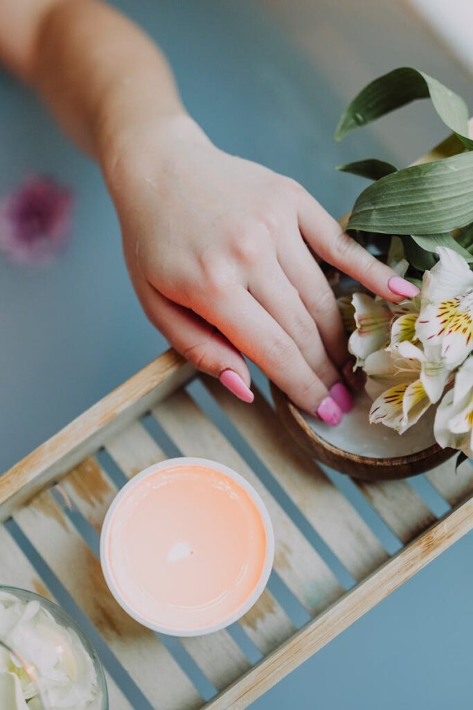 Elegant spa setting with flowers, bath salts, and calming ambiance for ultimate relaxation.